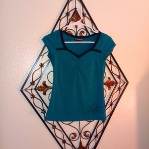 Turquoise Rocksteady top with embroidered Sparrow